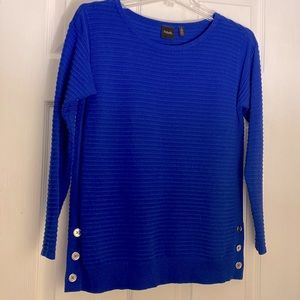 Royal blue wide-ribbed sweater with button details at bottom.